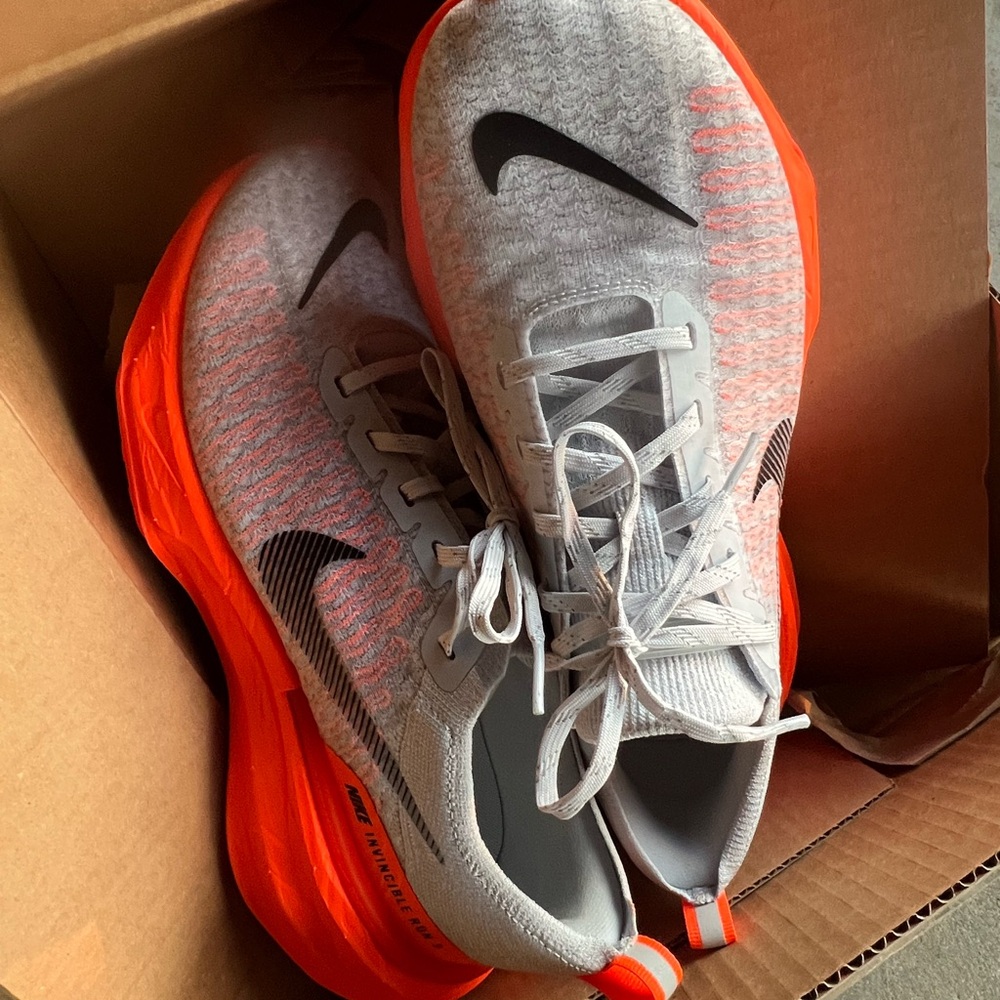 Nike Athletic Shoes in Gray with Orange Highlights